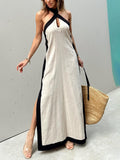 Vestido maxi de bloques de color con escote halter y abertura